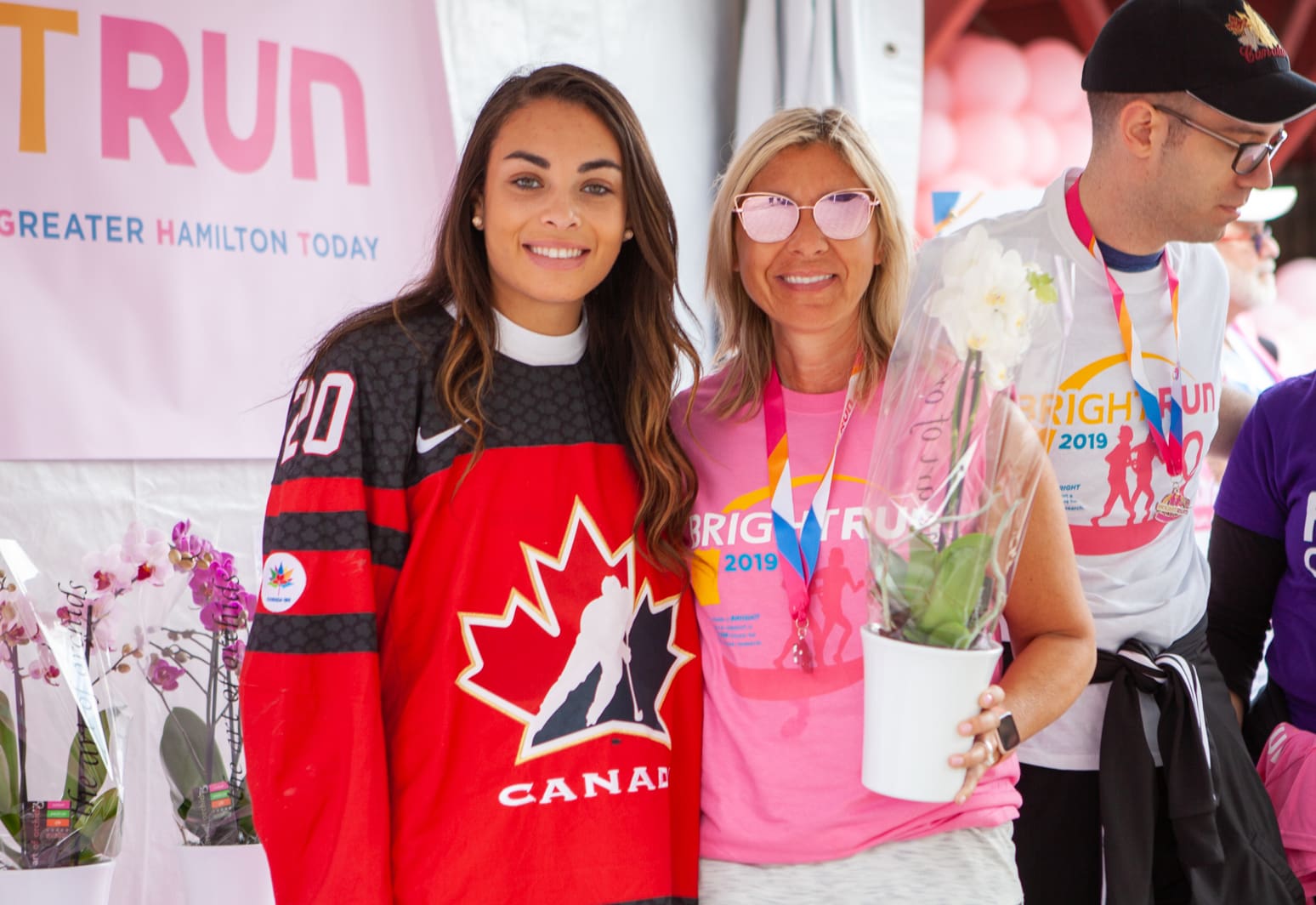 Sarah Nurse smiling with a volunteer